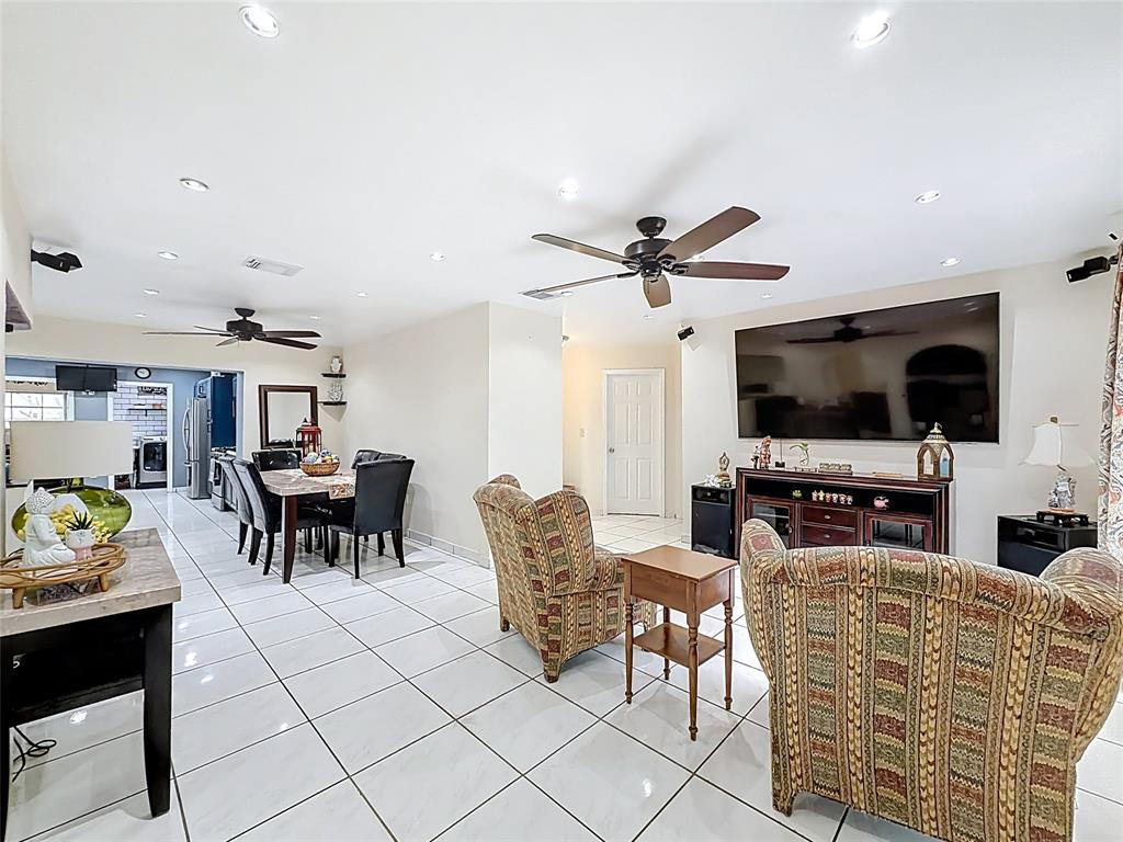 7141 Custer Street Hollywood, FL 33024 - Photo 18 of 84 a living room with furniture and a flat screen tv
