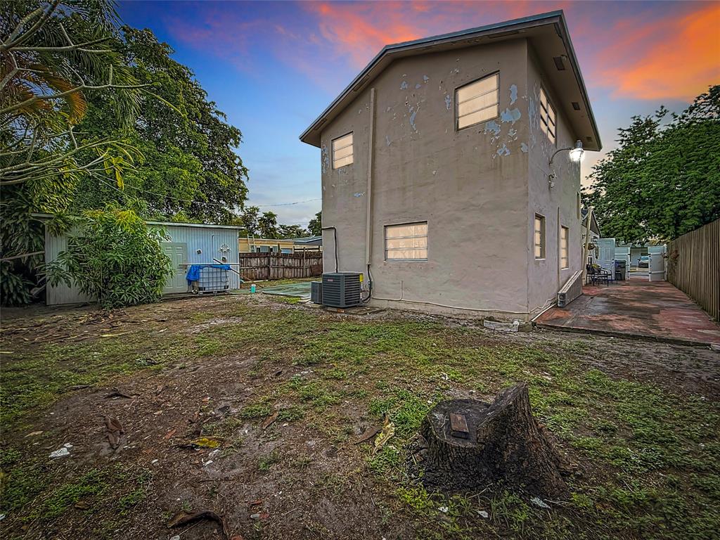 7141 Custer Street Hollywood, FL 33024 - Photo 22 of 84 a front view of a house with garden