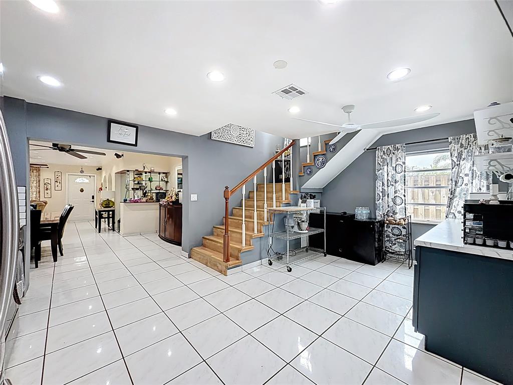 7141 Custer Street Hollywood, FL 33024 - Photo 32 of 84 a view of entryway wih livingroom and stairs