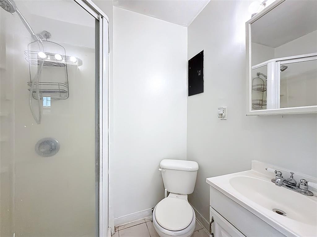 7141 Custer Street Hollywood, FL 33024 - Photo 58 of 84 a white toilet sitting next to a bathroom sink