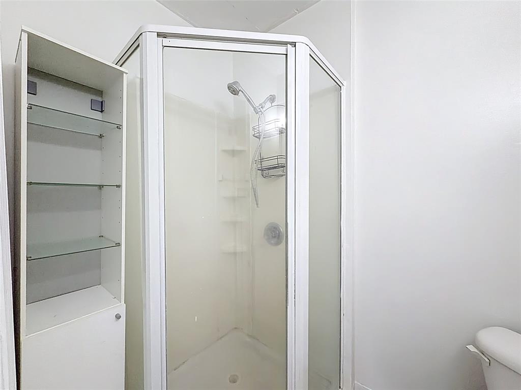 7141 Custer Street Hollywood, FL 33024 - Photo 59 of 84 a bathroom with a glass shower door