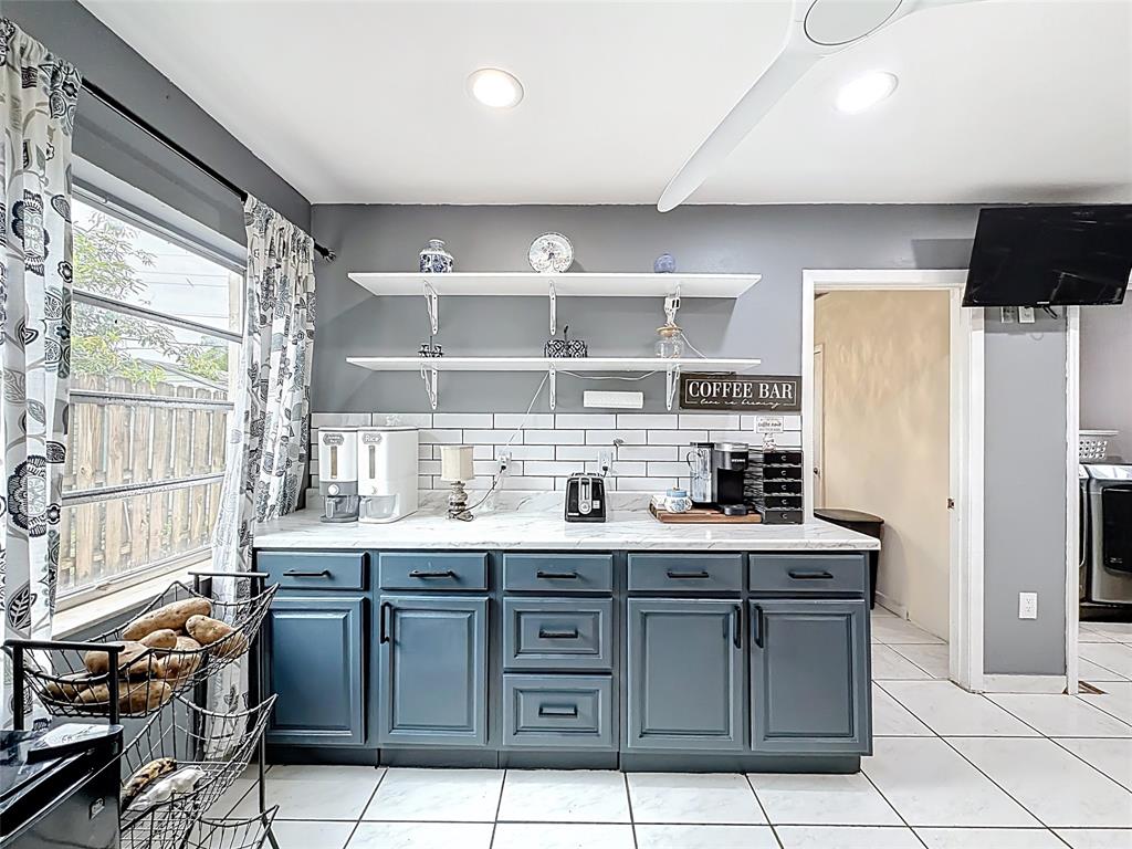 7141 Custer Street Hollywood, FL 33024 - Photo 7 of 84 a kitchen with stainless steel appliances granite countertop a sink and cabinets