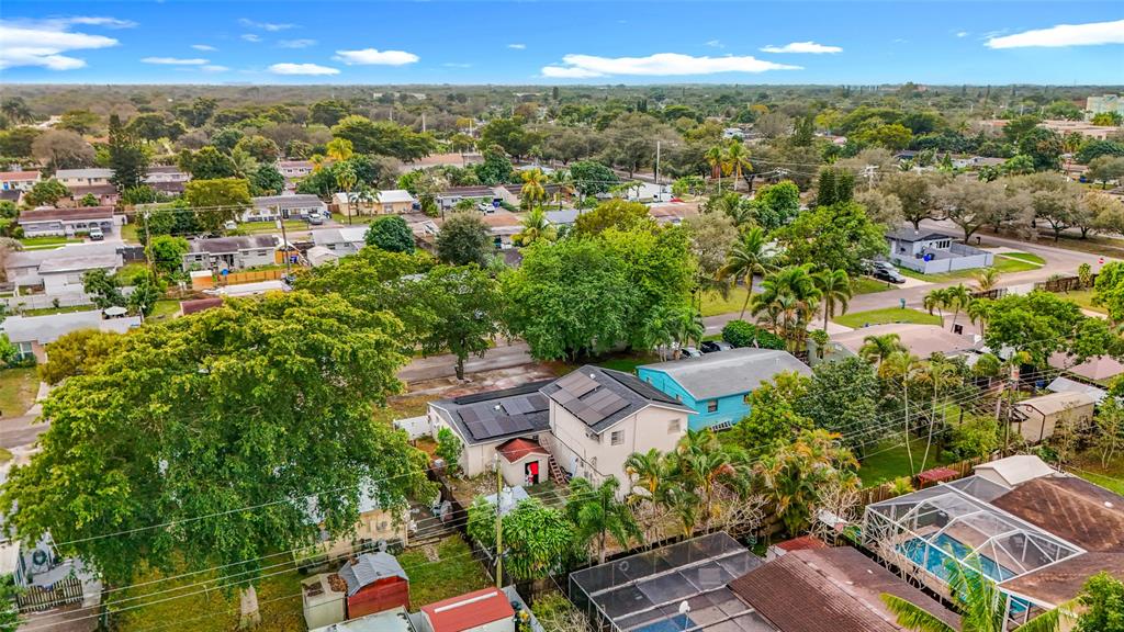 7141 Custer Street Hollywood, FL 33024 - Photo 78 of 84 an aerial view of residential houses with outdoor space and trees