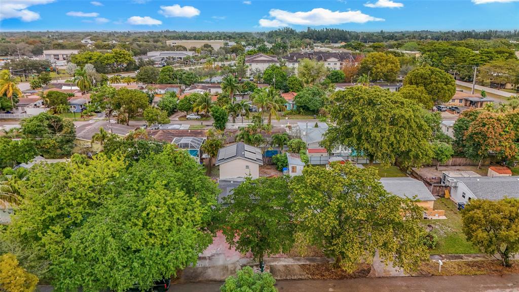 7141 Custer Street Hollywood, FL 33024 - Photo 83 of 84 an aerial view of residential houses with outdoor space and trees