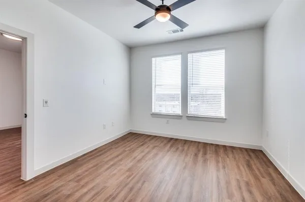 a bathroom with a sink a large mirror and vanity