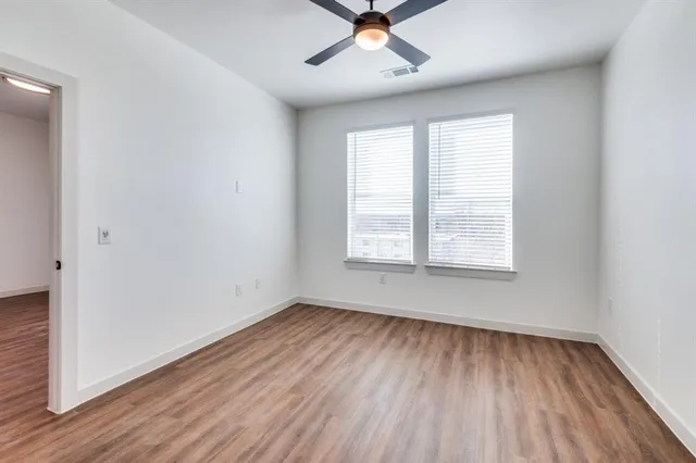 a bathroom with a sink a large mirror and vanity