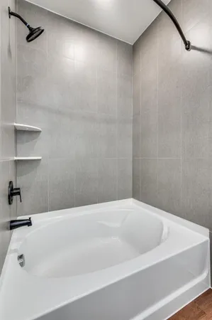 a bathroom with a double vanity sink and mirror