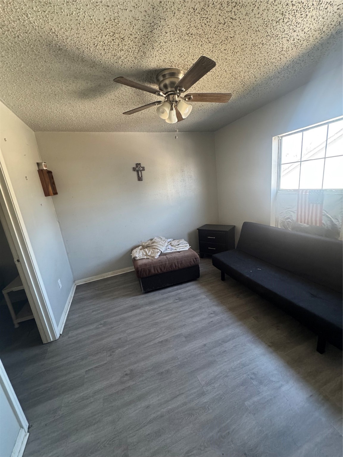 7018 Avenue F, Unit 1 Houston, TX 77011 - Photo 2 of 7 a living room with furniture and a window