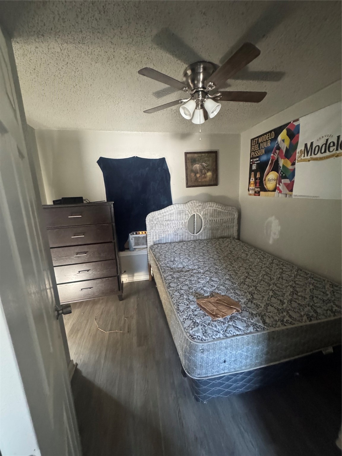 7018 Avenue F, Unit 1 Houston, TX 77011 - Photo 5 of 7 a living room with furniture and a chandelier