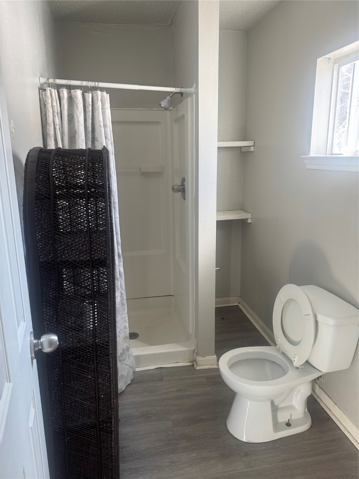 7018 Avenue F, Unit 1 Houston, TX 77011 - Photo 7 of 7 a white toilet sitting next to a bathroom sink