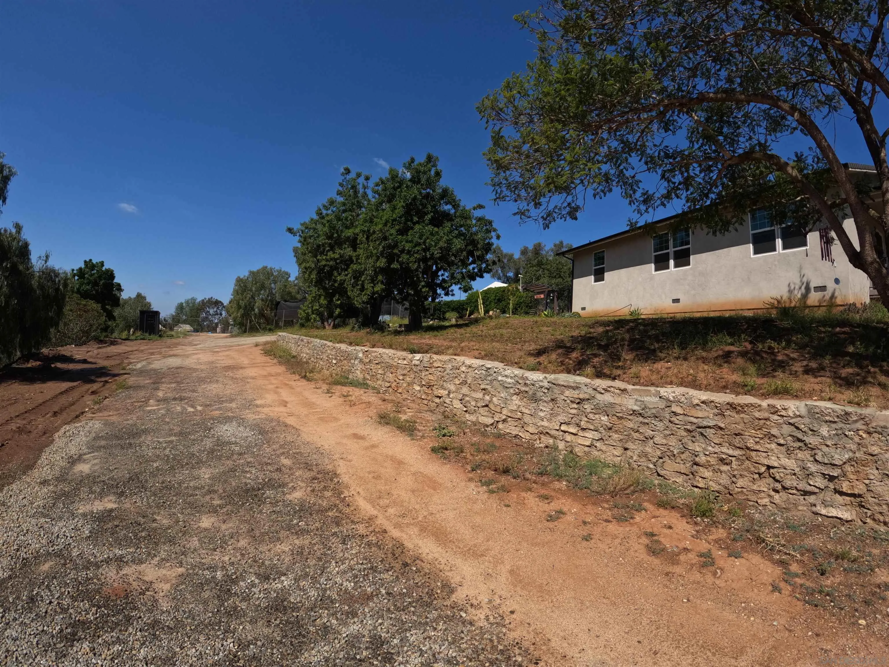 202 North Stage Coach Lane Fallbrook, CA 92028 - Photo 16 of 26 a view of a house with a yard