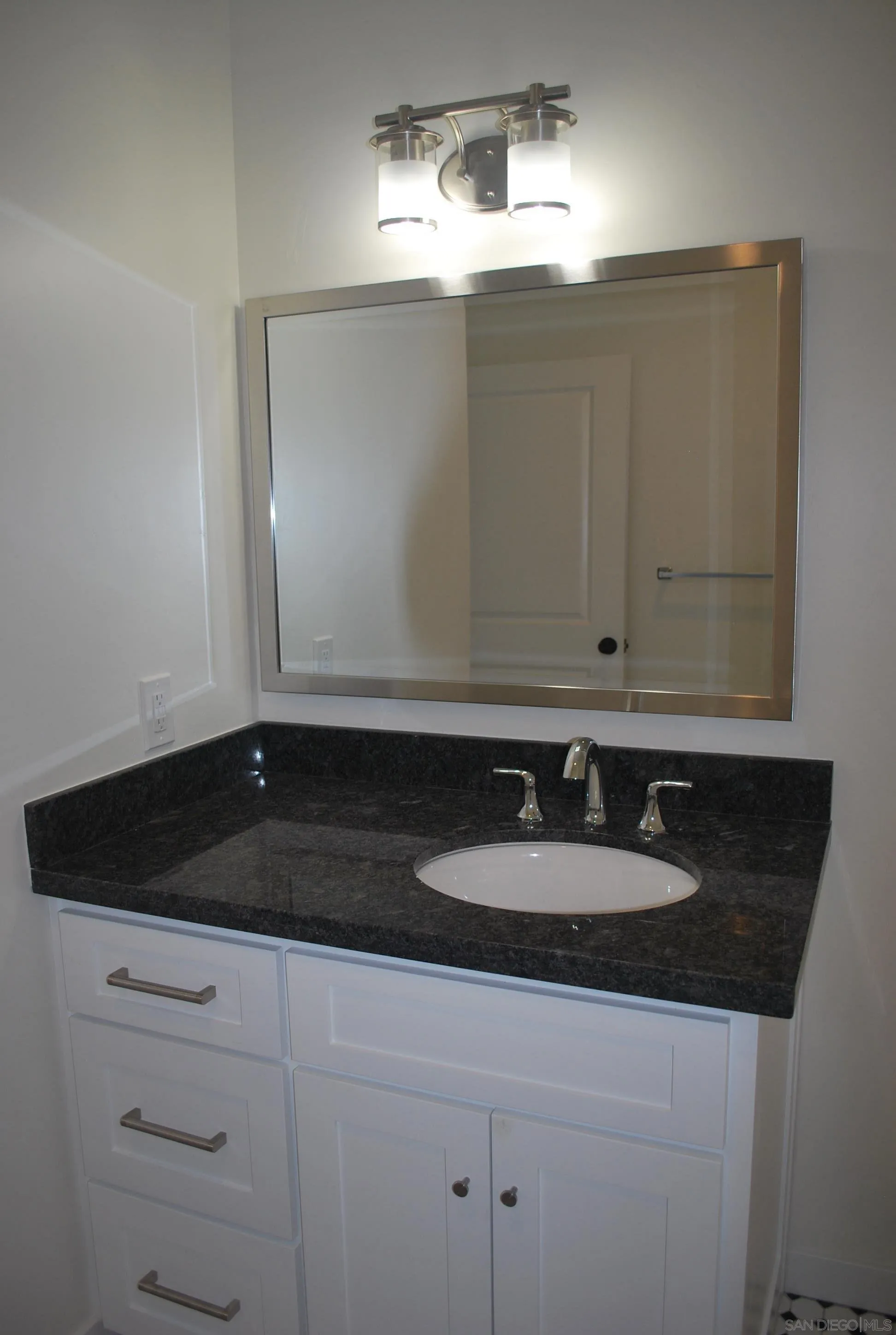 202 North Stage Coach Lane Fallbrook, CA 92028 - Photo 9 of 26 a bathroom with a sink and a mirror