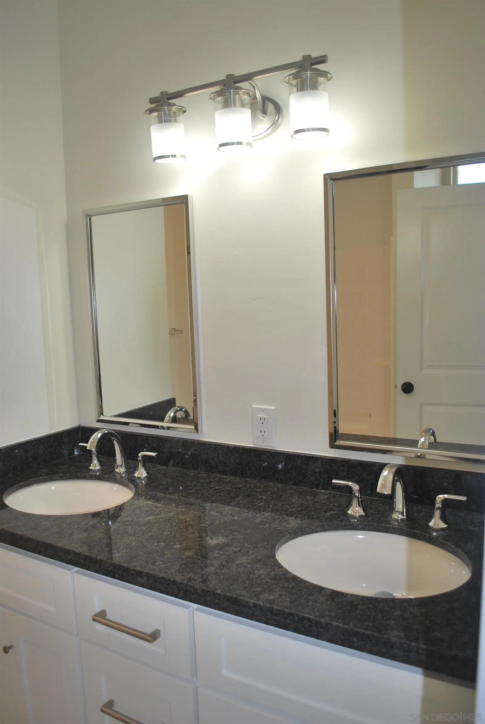 202 North Stage Coach Lane Fallbrook, CA 92028 - Photo 10 of 26 a bathroom with a sink and a mirror