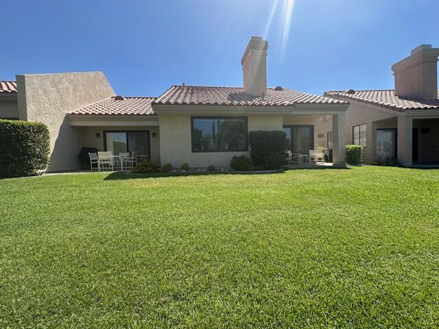 41694 Preston Trail Palm Desert, CA 92211 - Photo 19 of 20 a front view of a house with a yard and garage