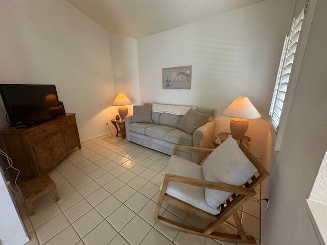 41694 Preston Trail Palm Desert, CA 92211 - Photo 6 of 20 a living room with furniture a lamp and a flat screen tv