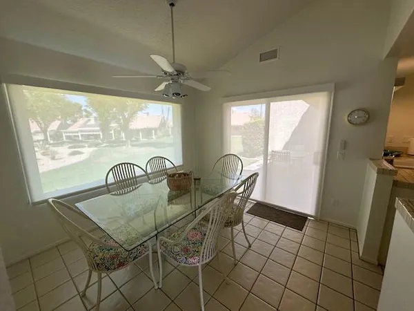 a kitchen with stainless steel appliances granite countertop a refrigerator sink and stove
