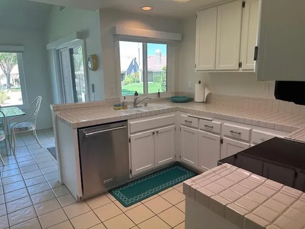 a kitchen with appliances and cabinets