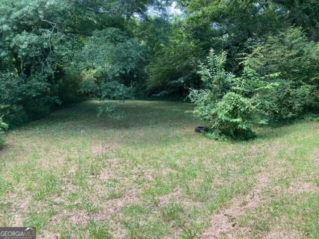 a kitchen with a stove and a refrigerator