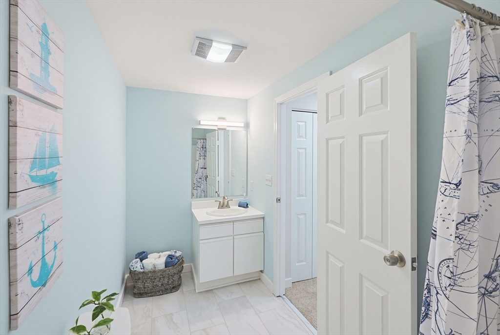 45 Main Street, Unit 35 Wareham, MA 02571 - Photo 20 of 34 a bathroom with a sink a toilet and shower