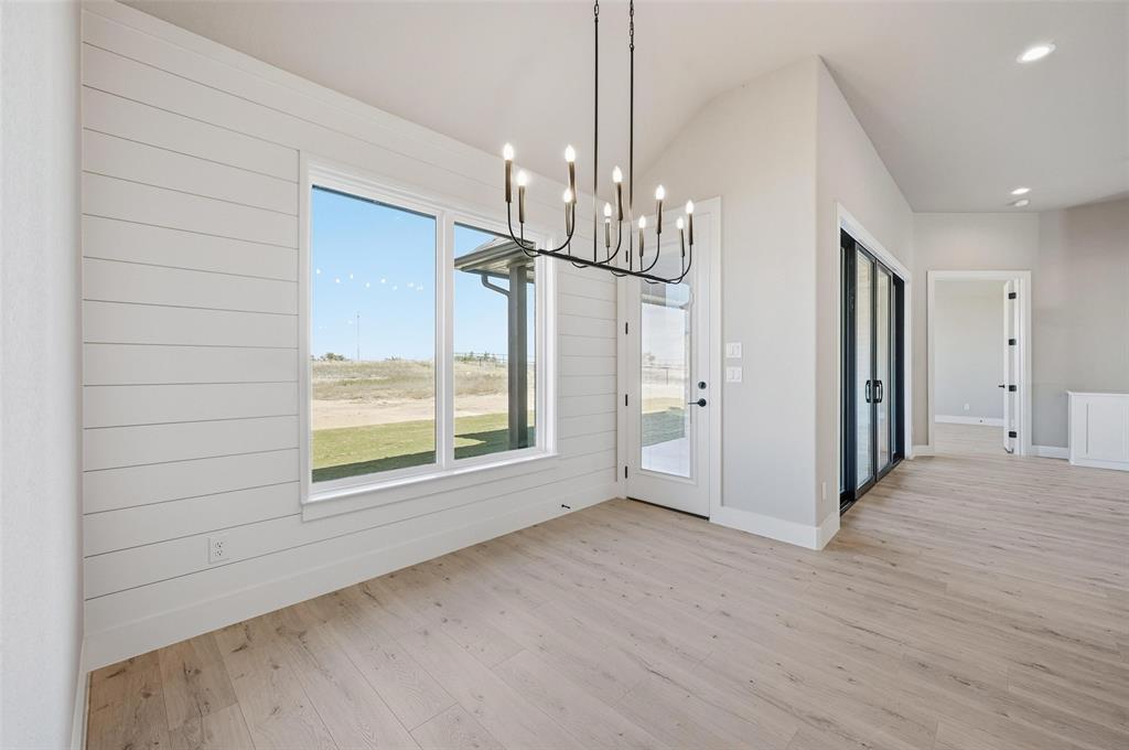 108 Rocky Top Azle, TX 76020 - Photo 19 of 40 a view of empty room with wooden floor and fan