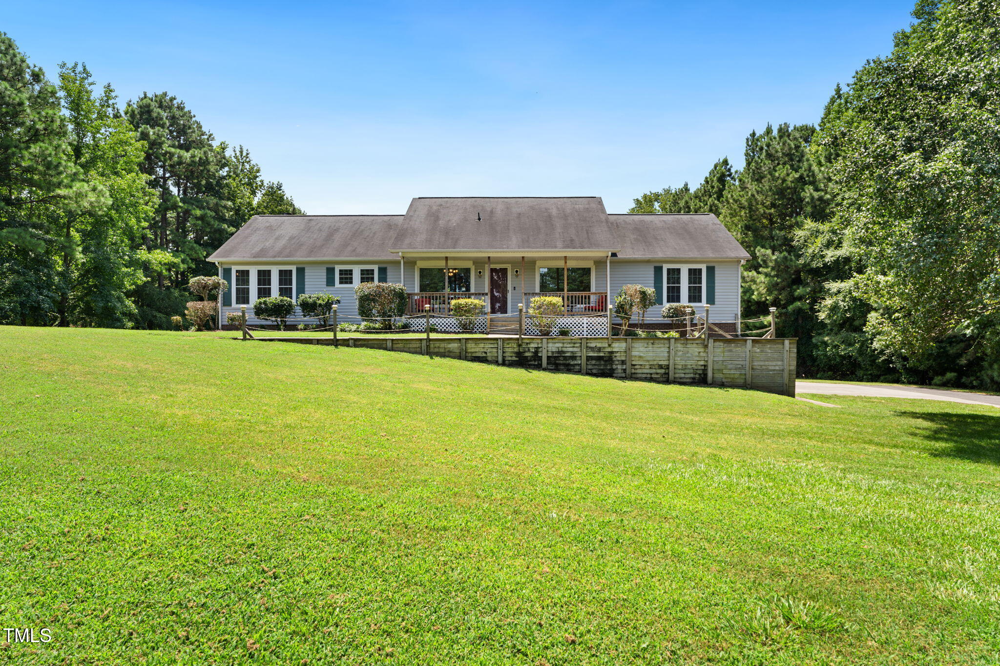 1855 Bullocksville Park Road Manson, NC 27553 - Photo 1 of 46 a front view of a house with a garden and porch