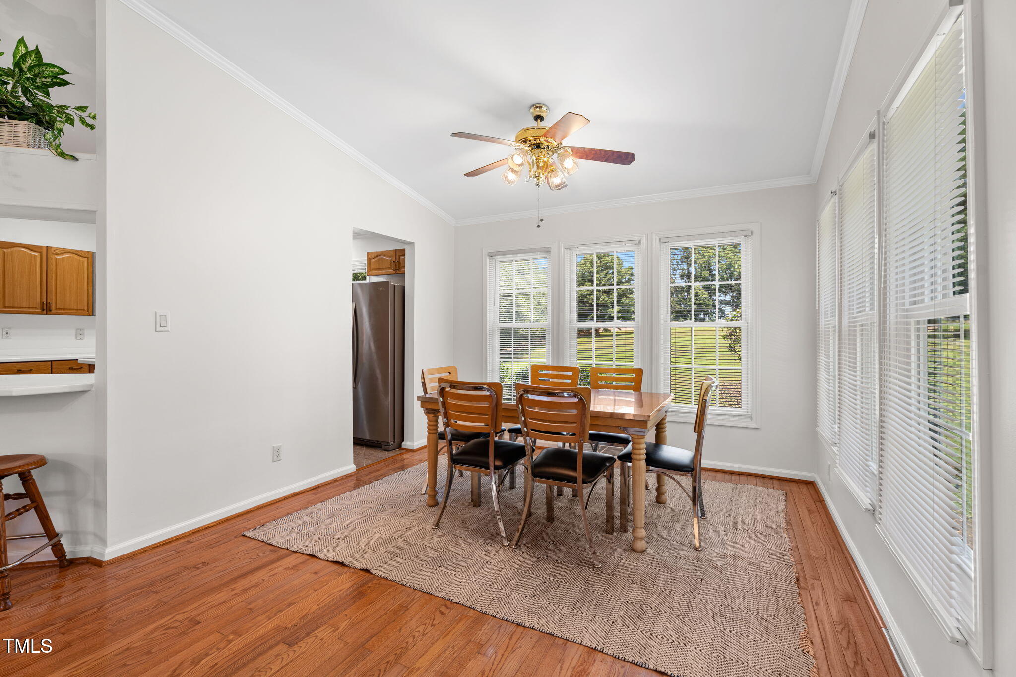 1855 Bullocksville Park Road Manson, NC 27553 - Photo 13 of 46 a dining room with wooden floor a chandelier a wooden table and chairs
