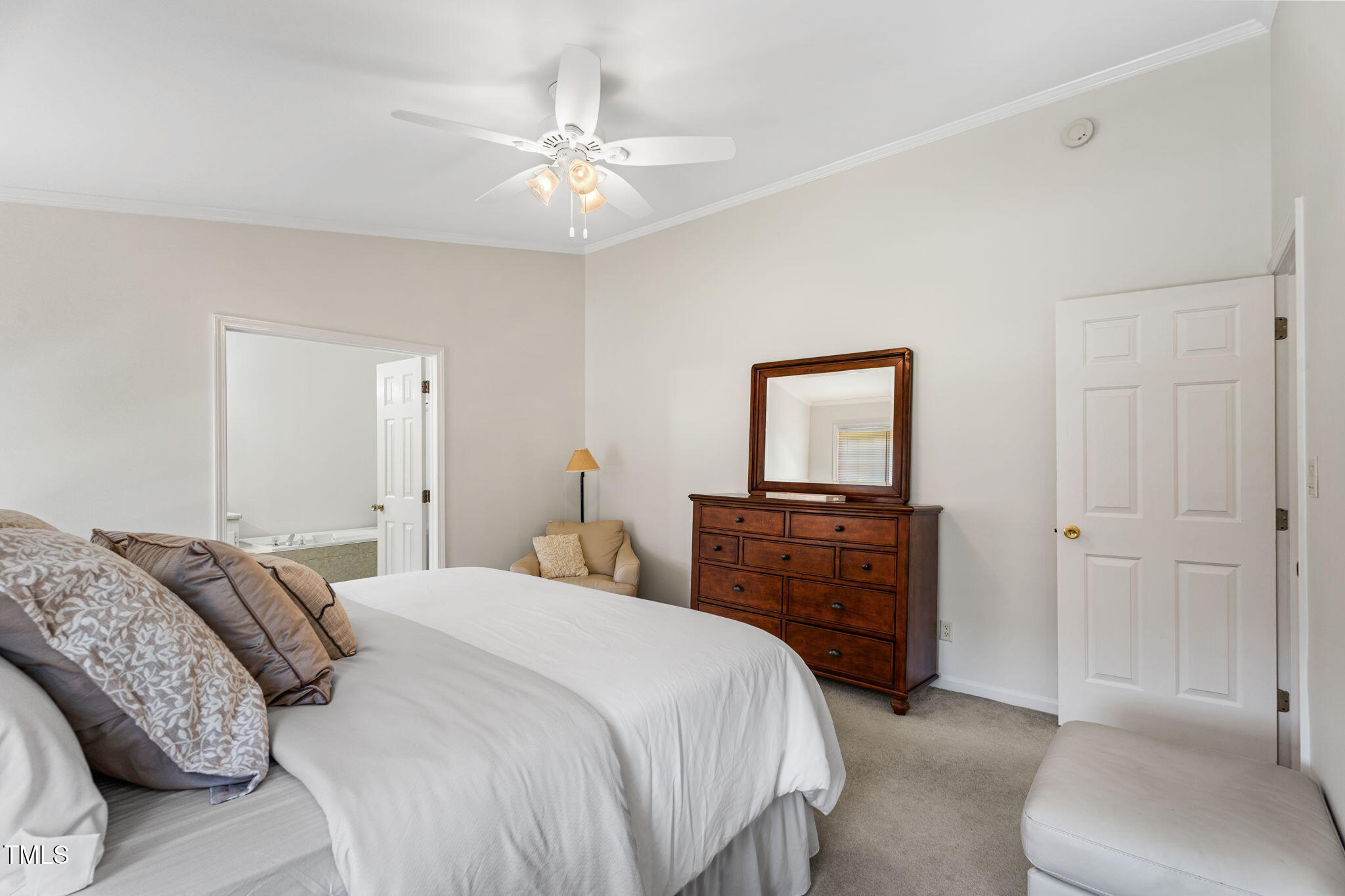 1855 Bullocksville Park Road Manson, NC 27553 - Photo 15 of 46 a bedroom with a bed and a chandelier