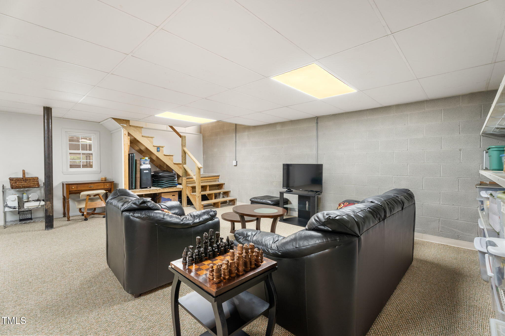 1855 Bullocksville Park Road Manson, NC 27553 - Photo 30 of 46 a living room with furniture a flat screen tv and a table