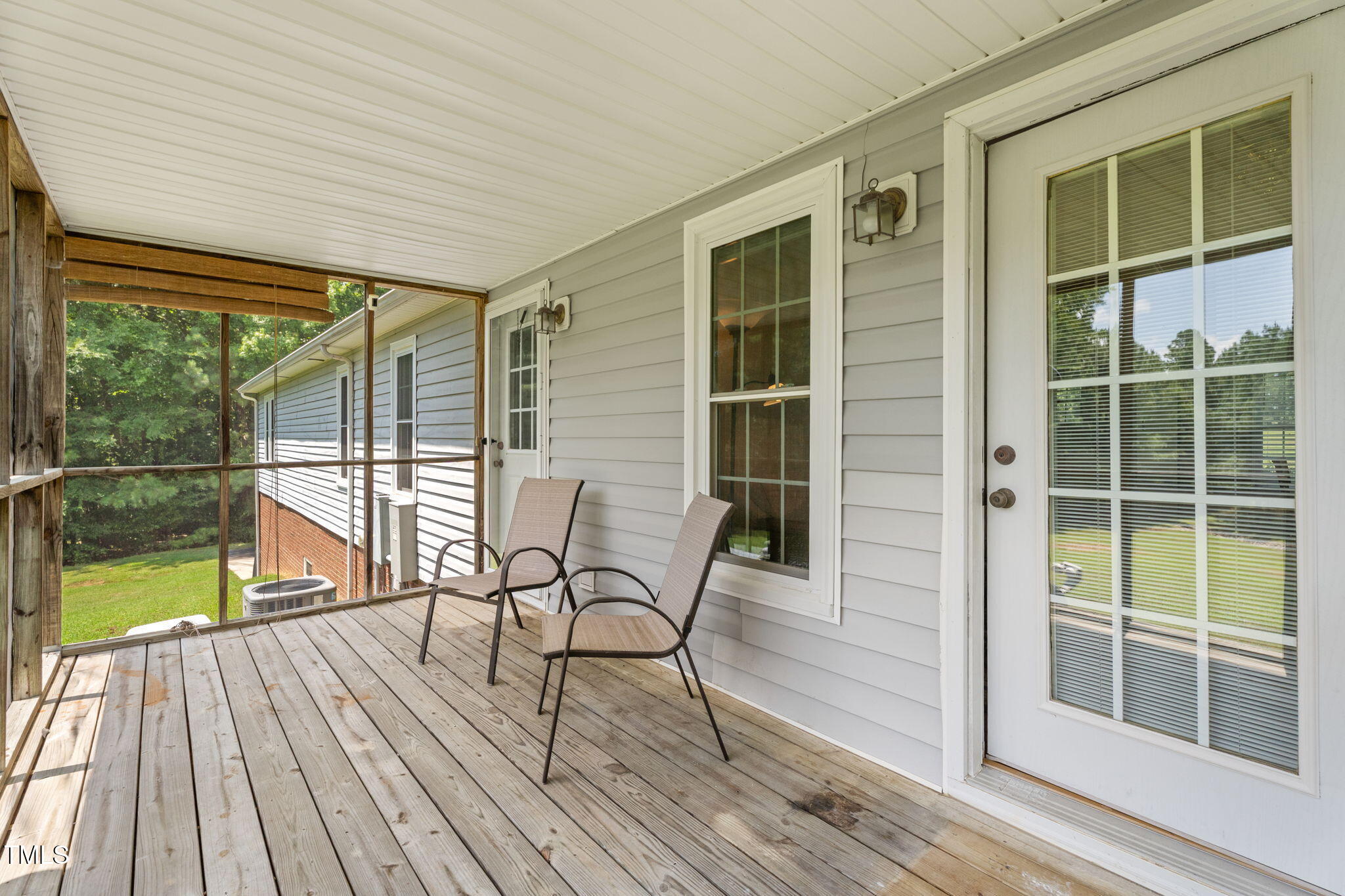 1855 Bullocksville Park Road Manson, NC 27553 - Photo 34 of 46 a balcony with wooden floor and glass door
