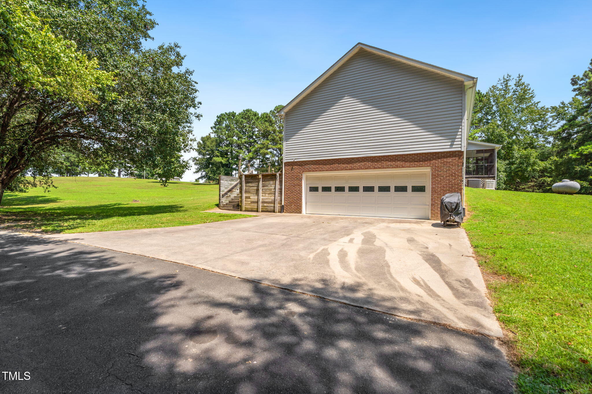 1855 Bullocksville Park Road Manson, NC 27553 - Photo 40 of 46 a view of house with outdoor space and trees