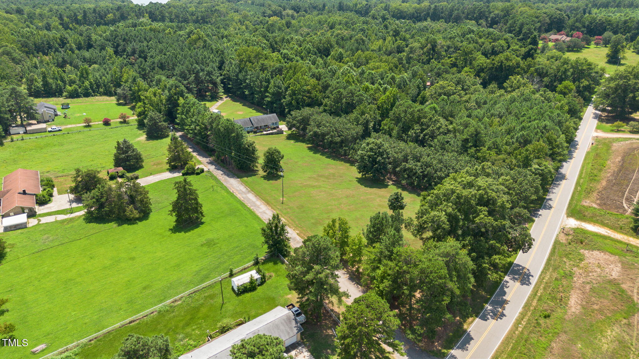 1855 Bullocksville Park Road Manson, NC 27553 - Photo 44 of 46 an aerial view of lake residential house with outdoor space and trees around