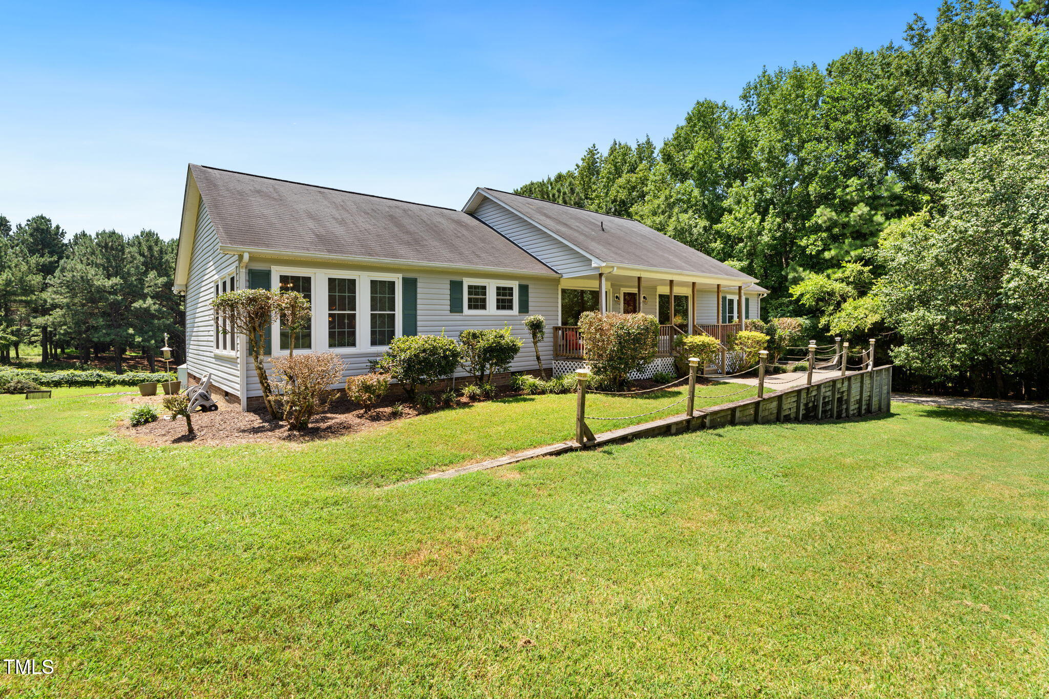 1855 Bullocksville Park Road Manson, NC 27553 - Photo 45 of 46 a view of a house with backyard porch and garden