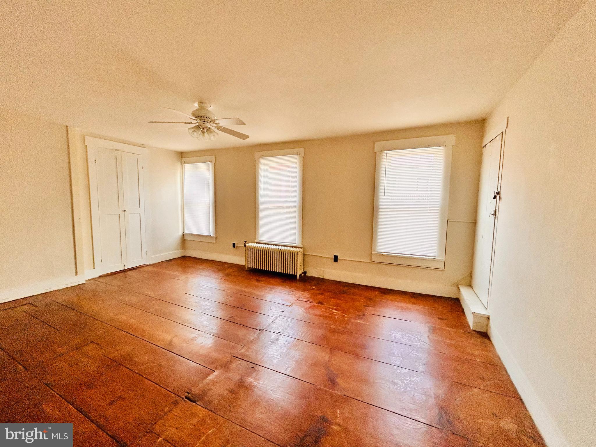 113 West Main Street Millheim, PA 16854 - Photo 16 of 30 a view of a livingroom with an empty space and a window