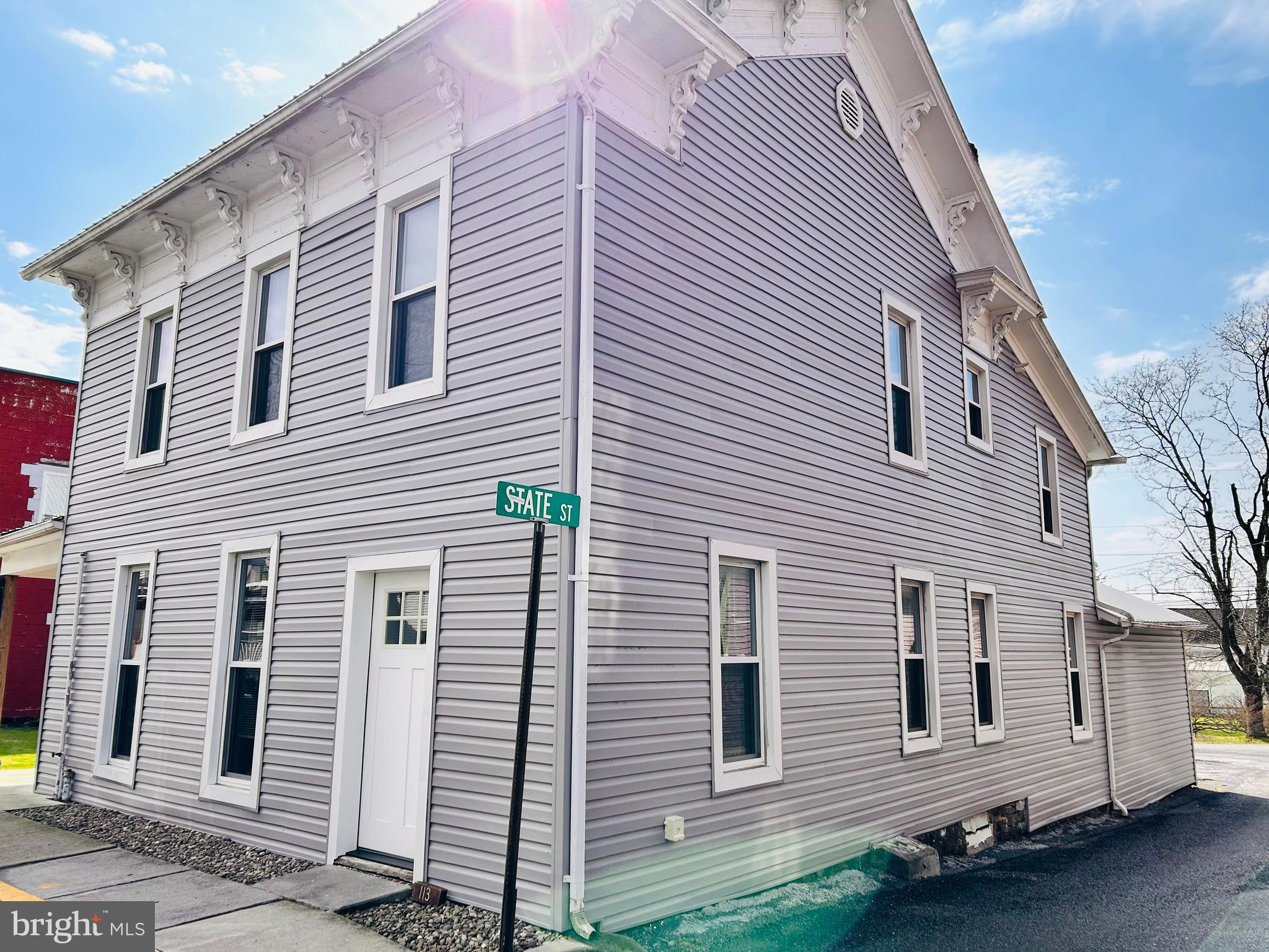 113 West Main Street Millheim, PA 16854 - Photo 2 of 30 a view of a house with a balcony