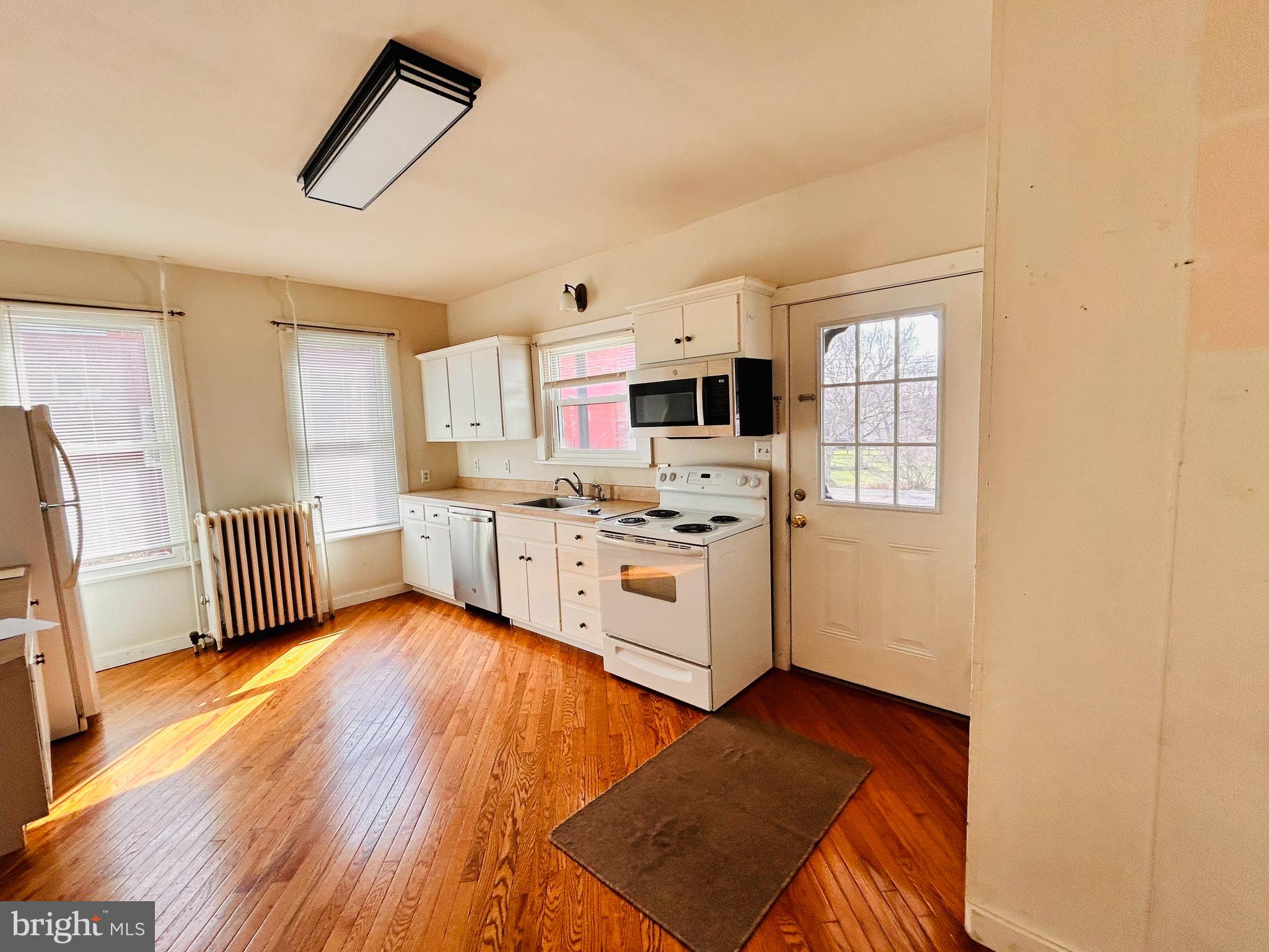 113 West Main Street Millheim, PA 16854 - Photo 27 of 30 a kitchen with stainless steel appliances a refrigerator and a stove top oven