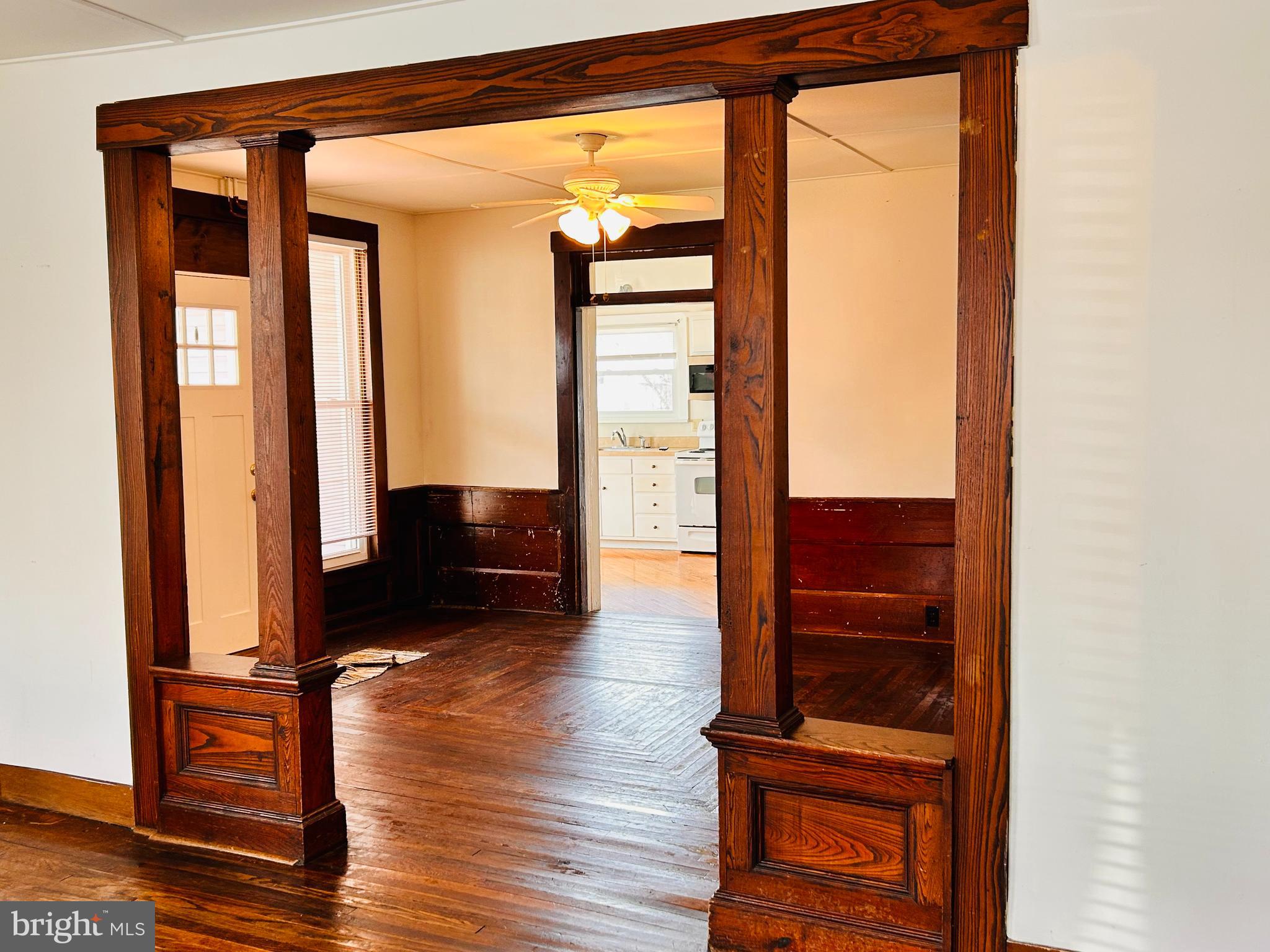 113 West Main Street Millheim, PA 16854 - Photo 30 of 30 a view of front door with wooden floor and chair