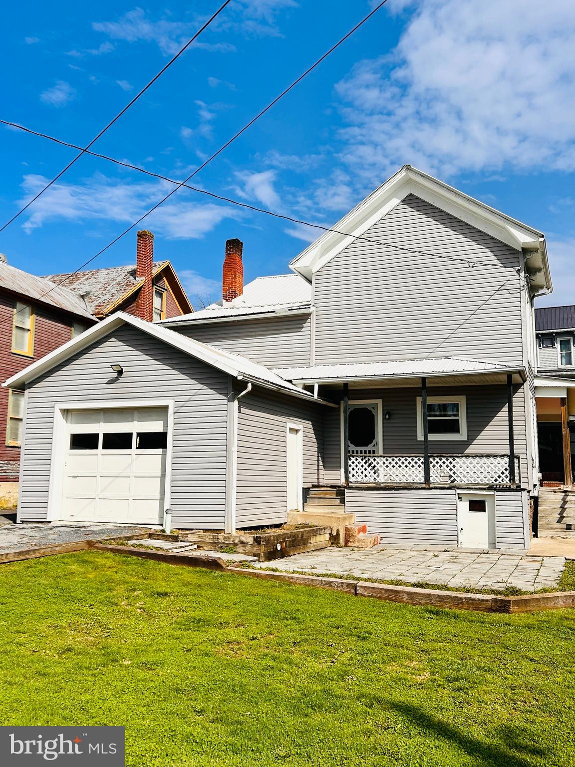113 West Main Street Millheim, PA 16854 - Photo 3 of 30 a backyard of a house with table and chairs