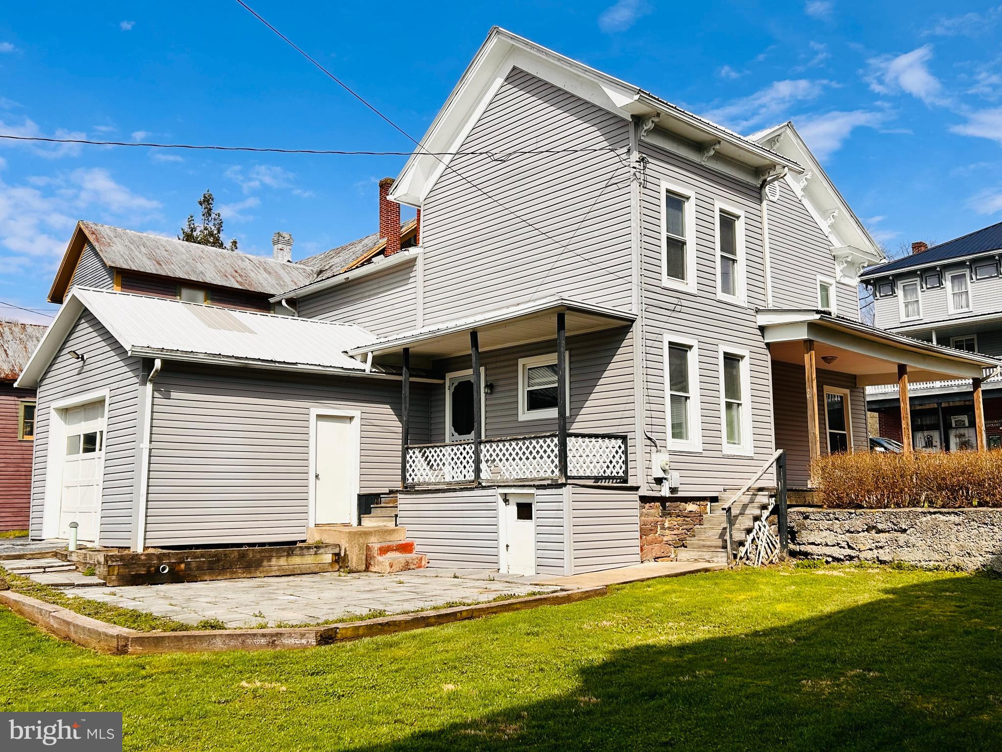 113 West Main Street Millheim, PA 16854 - Photo 5 of 30 a view of a house with swimming pool and a yard