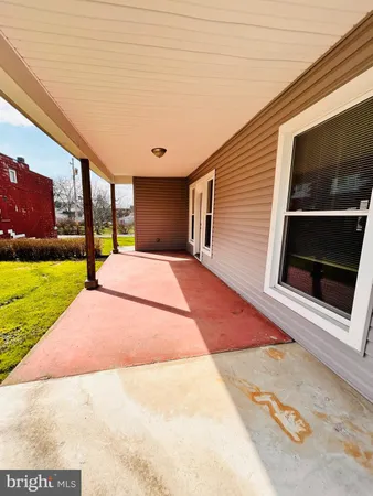a backyard of a house with swimming pool and window
