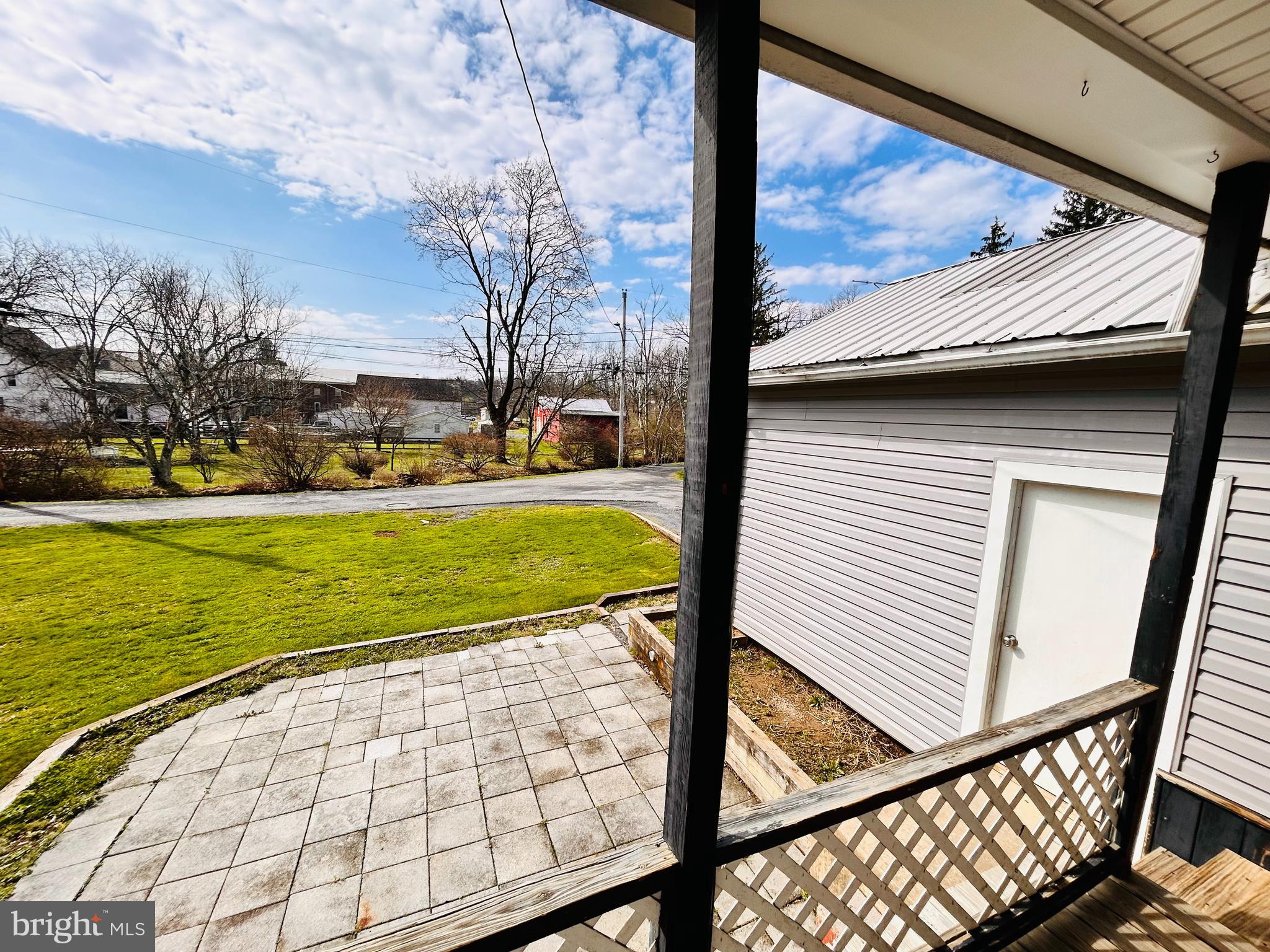 113 West Main Street Millheim, PA 16854 - Photo 8 of 30 a view of a porch with a table and chairs