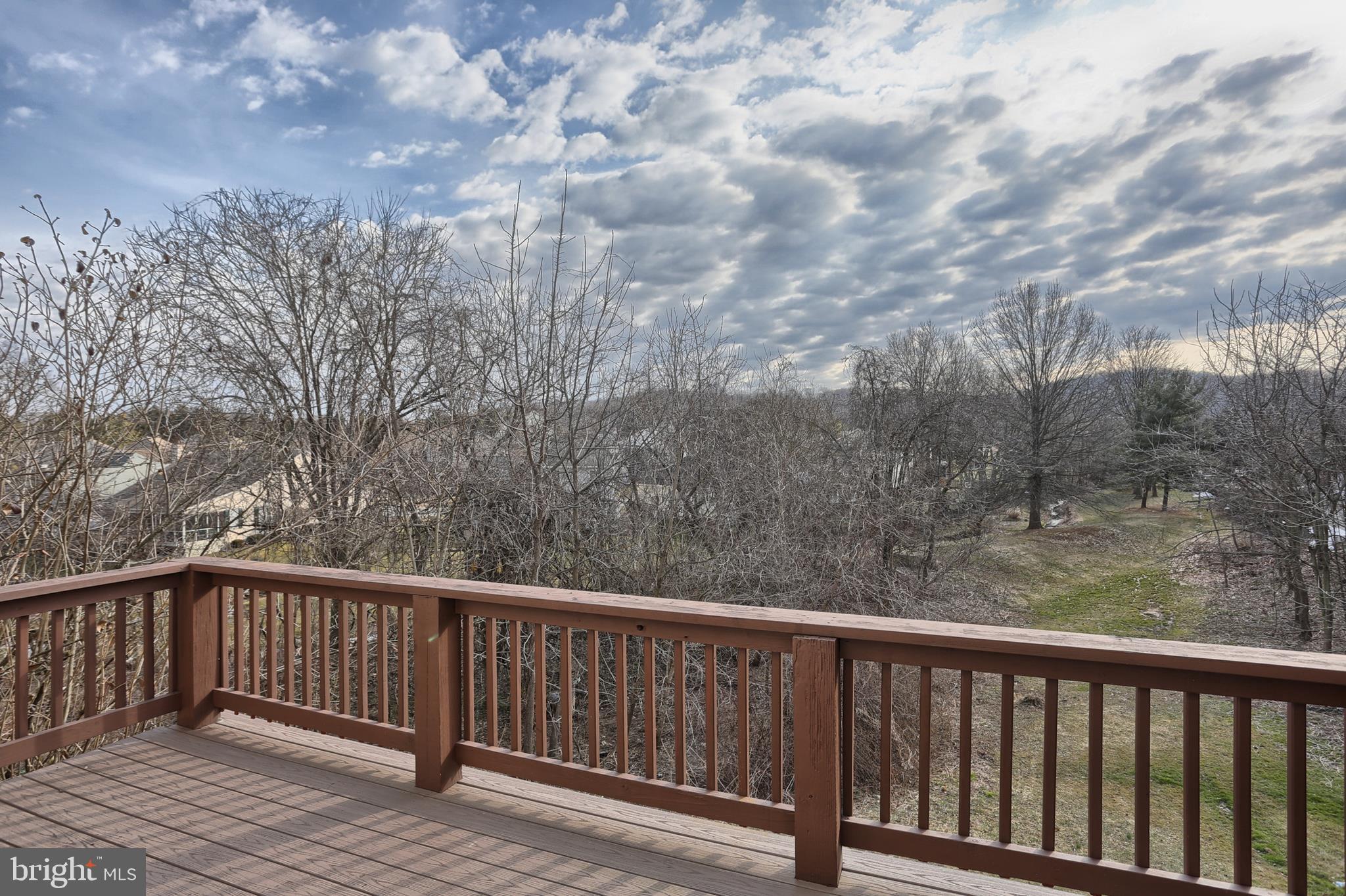 2051 B Raleigh Road, Unit B Hummelstown, PA 17036 - Photo 11 of 27 a balcony with wooden floor and fence