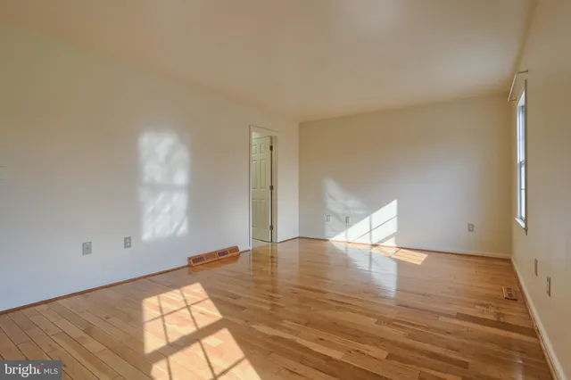 a view of a livingroom with wooden floor