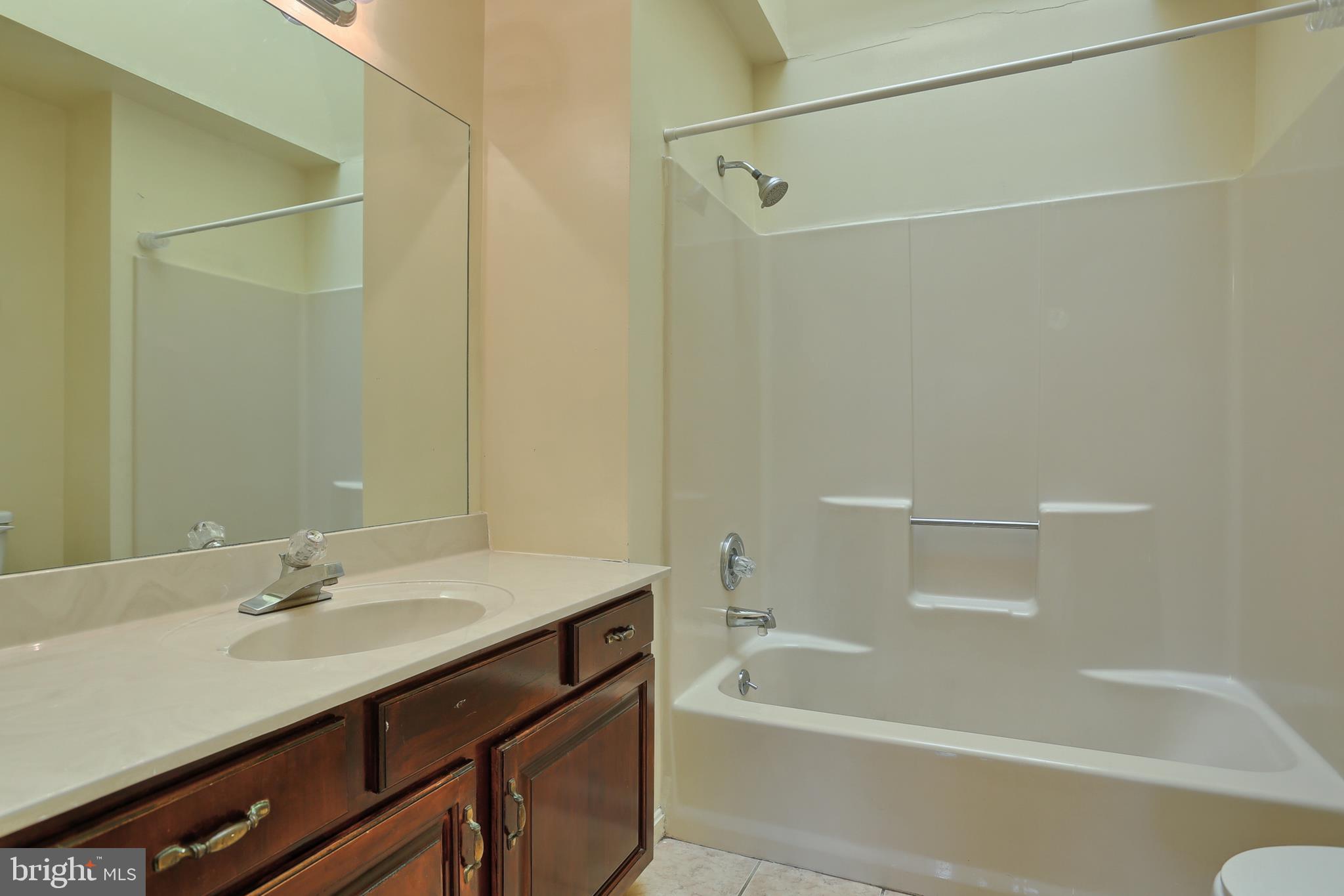 2051 B Raleigh Road, Unit B Hummelstown, PA 17036 - Photo 15 of 27 a bathroom with a sink and a bathtub