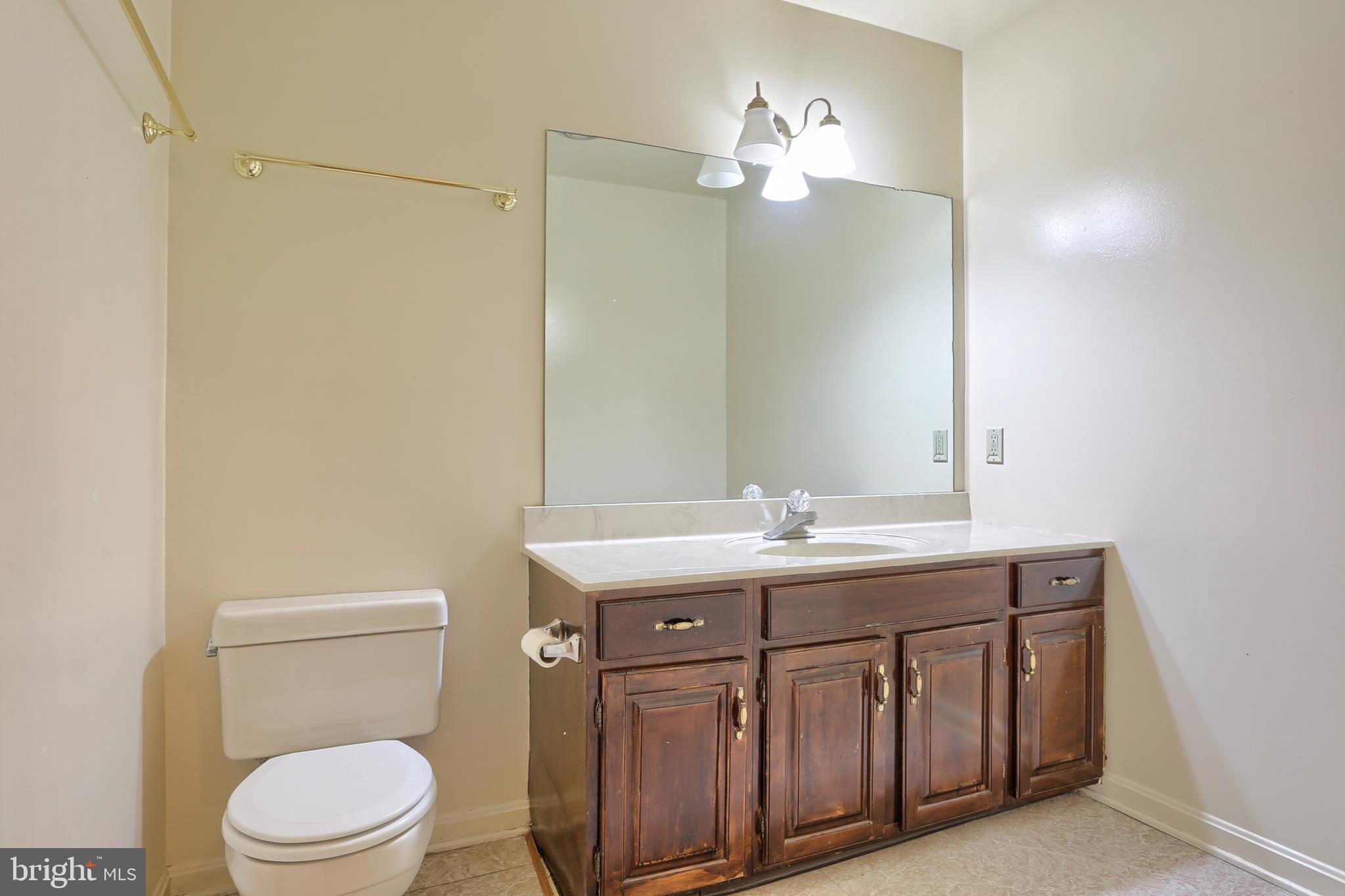 2051 B Raleigh Road, Unit B Hummelstown, PA 17036 - Photo 23 of 27 a bathroom with a toilet a sink a mirror and a shower