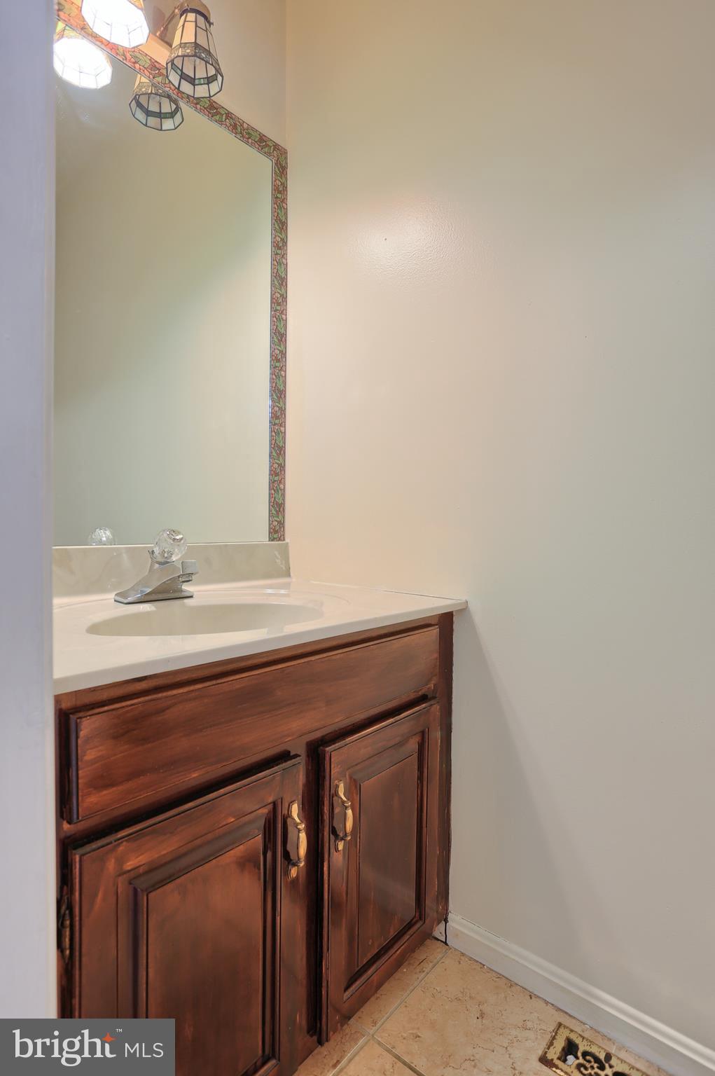 2051 B Raleigh Road, Unit B Hummelstown, PA 17036 - Photo 6 of 27 a bathroom with a sink and a mirror