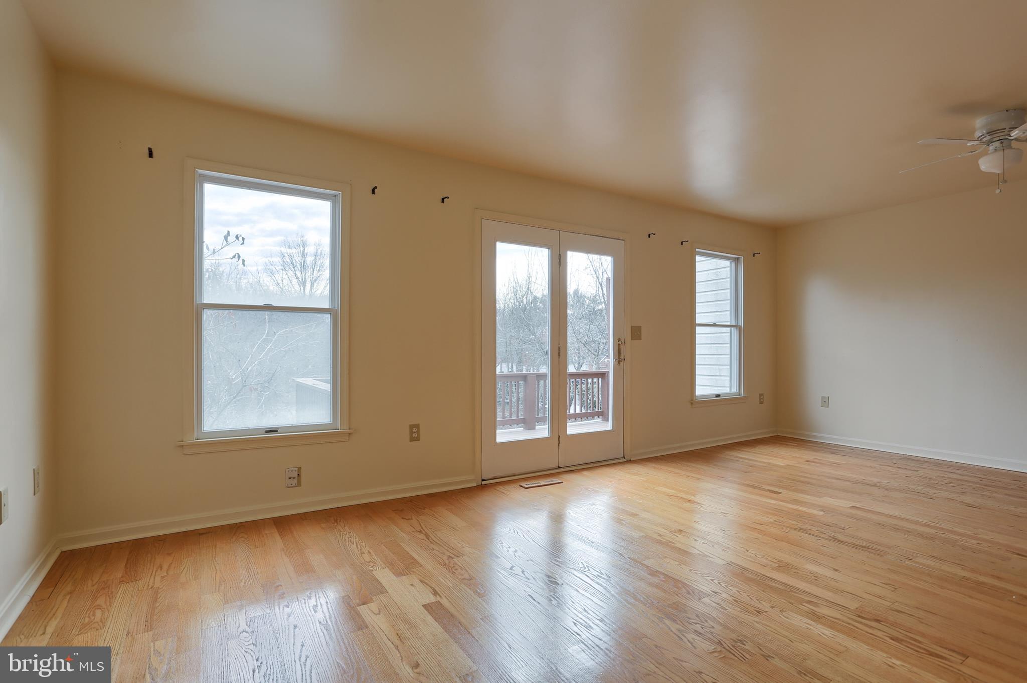 2051 B Raleigh Road, Unit B Hummelstown, PA 17036 - Photo 10 of 27 a view of an empty room with wooden floor and a window