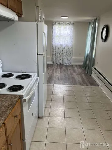 a kitchen with a stove a refrigerator a sink and dishwasher
