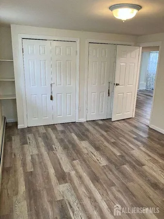 a view of entryway with wooden floor