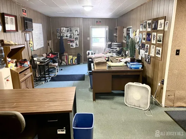 a view of a workspace with furniture and a couch