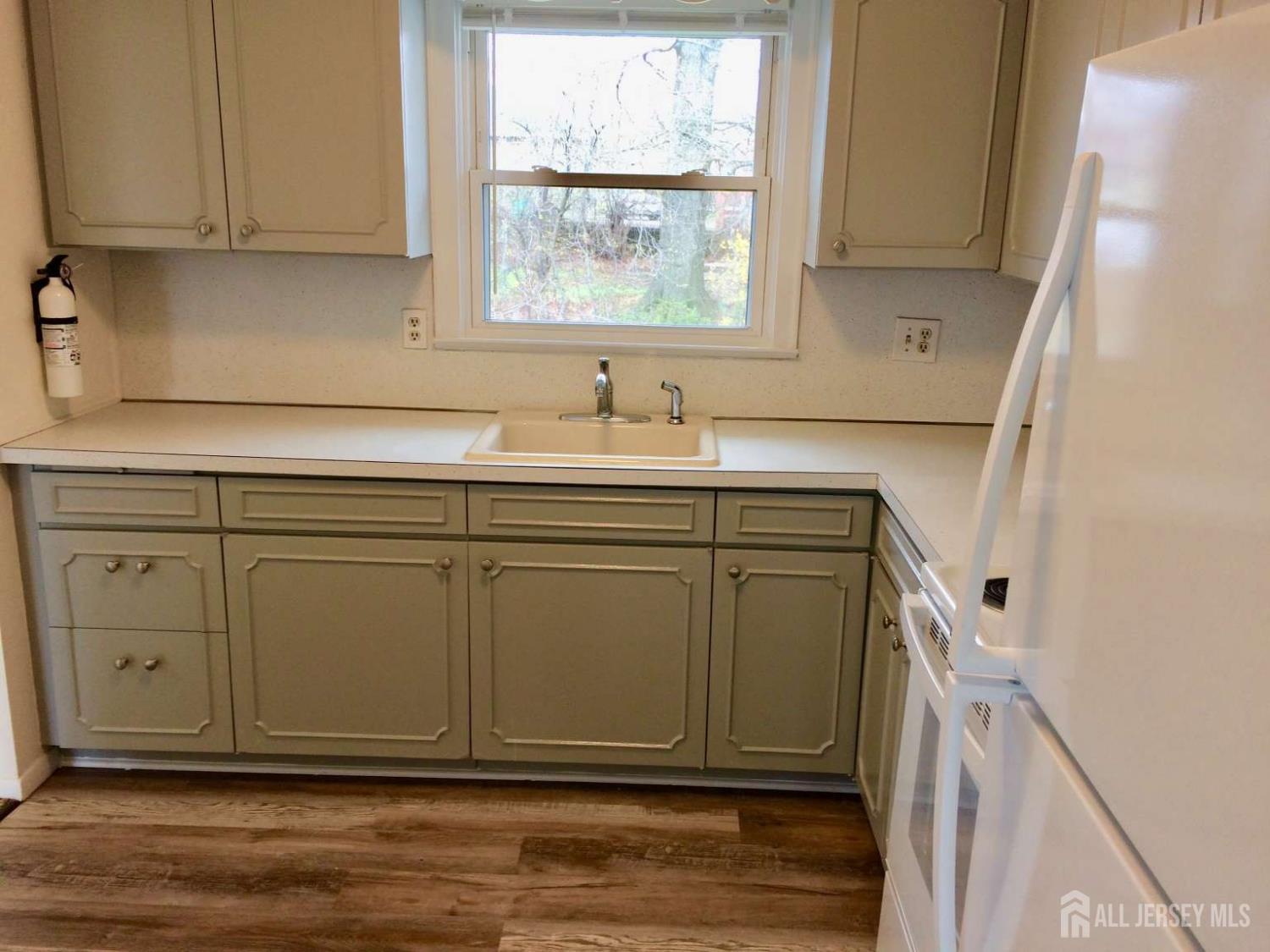 141 Dunbar Avenue Fords, NJ 08863 - Photo 10 of 25 a view of cabinets a sink and a window